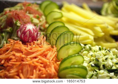 Still life with fresh raw sliced vegetable assorted  close up