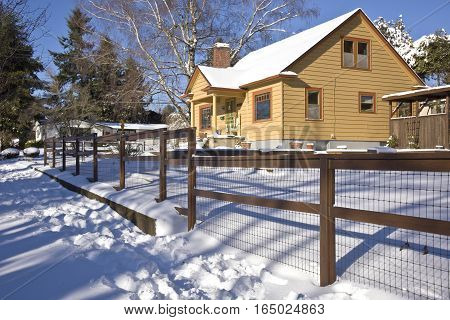 Family home and snow covered ground Gresham Oregon.