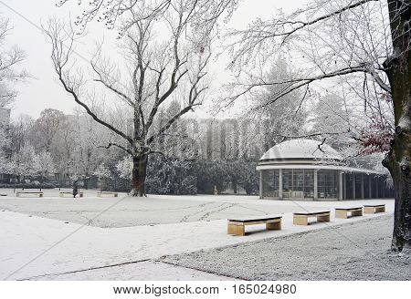 View on Kolonada Libensky, gallery in Podebrady, popular Czech spa city. Empty benches in winter park