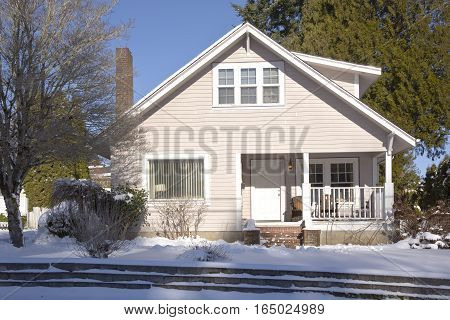 Family home and snow covered ground Gresham Oregon.
