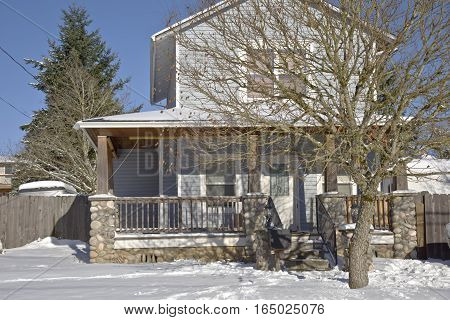 Family home and snow covered ground Gresham Oregon.
