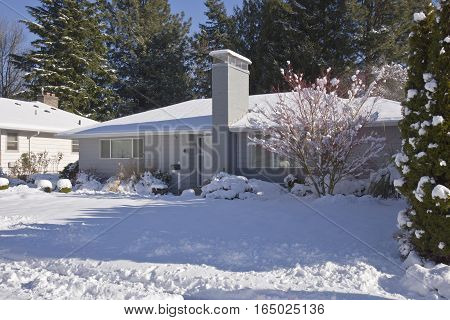 Family home and snow covered ground Gresham Oregon.