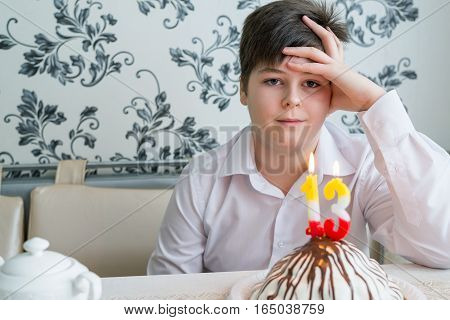 Upset teenager alone marks the 13th birthday