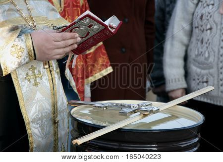 VOYUTYN UKRAINE - 14 OCTOBER 2008: Orthodox priest blessing of water during the religious celebration Pokrov