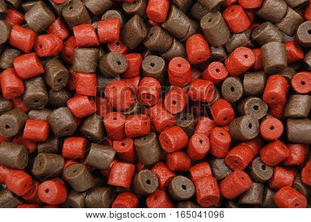 Brown with red pre-drilled halibut pellets for carp fishing background