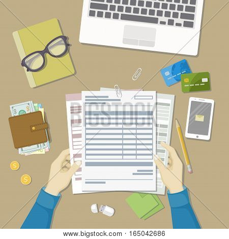 Man working with documents. Human hands hold the accounts, payroll, tax form. Workplace with papers, blanks, forms, phone with message, wallet with money, credit cards, glasses, notepad Top viewVector