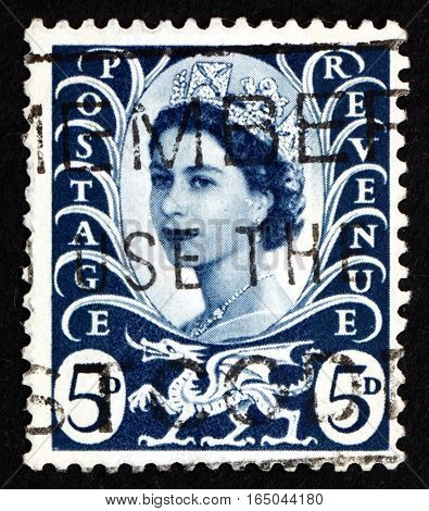 GREAT BRITAIN - CIRCA 1968: a stamp printed in the Great Britain shows Her Majesty the Queen Elizabeth II Portrait and Welsh Dragon circa 1968