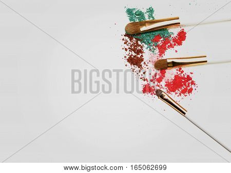 Makeup highlighter, make-up on Valentine's Day, shadow and brushes for make-up, make-up artist for the tools.