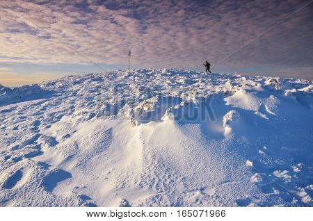 Fantastic evening winter landscape. Dramatic overcast sky.