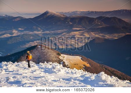 Fantastic evening winter landscape. Dramatic overcast sky.