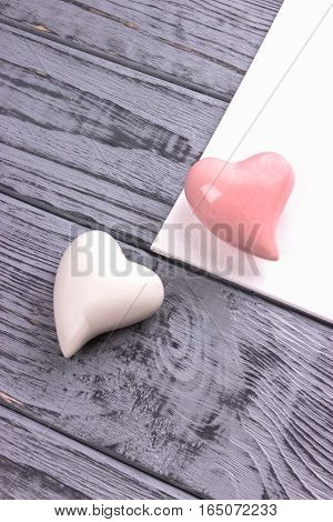Vanlentine's day concept. Two hearts on the gray wooden background