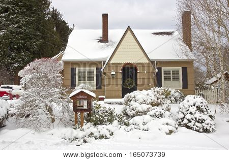 Family home and snow covered ground Gresham Oregon.