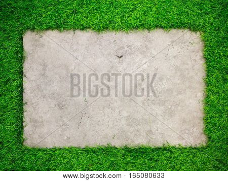 Square concrete plate on artificial green grass background
