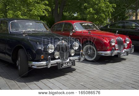 TURKU, FINLAND - JUNE 13, 2015: Two Jaguar Mk.-1 50-ies of the exhibition and parade of vintage cars. Turku, Finland