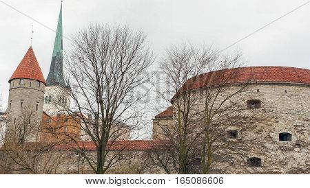 Walls of Old Town of Tallinn. Fat Margaret's Tower and St Olaf's Church, Tallinn's Medieval Old Town, Estonia, Europe.
