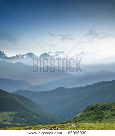 Hills during sunrise in mountain valley. Beautisul natural landscape
