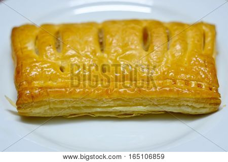 Pineapple pie on a white plate for breakfast.