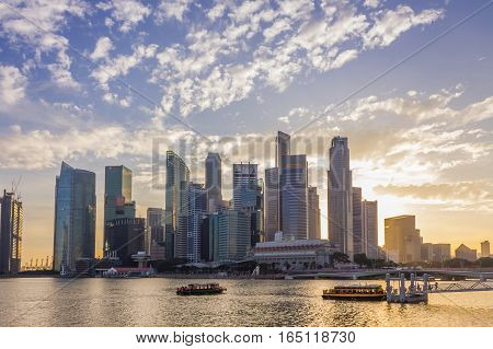 Singapore - January 07 2017: Singapore Cityscape Financial building with Dramatic Cloud in Marina Bay area SingaporeBoat Quay Golden Hour Urban Dusk