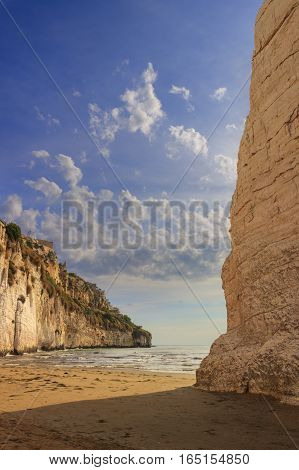 Gargano coast: bay of Vieste,(Apulia) ITALY.Castello or Scialara beach:it is overshadowed by the Swabiam Castle and the Pizzomunno Monolith (from the local dialect: peak of cape of the world).