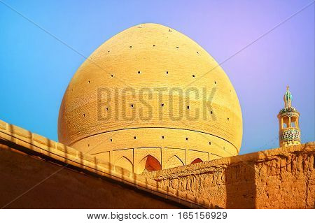 Iran Kashan Juma Friday mosque in the rays of the evening sun.