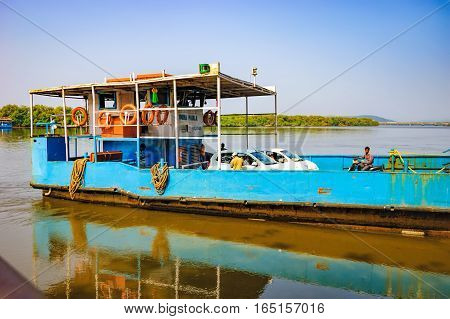 Goa, India - November 13, 2012: Ferry arriving to Chorao island Salim Ali Bird Sanctuary, Goa, India. Ferries is the only means of transport across the many rivers of India, as there is no bridge.