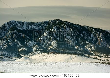 Flatirons Mountains in Boulder Colorado on a Cold Snowy Winter Day with the National Center for Atmospheric Research