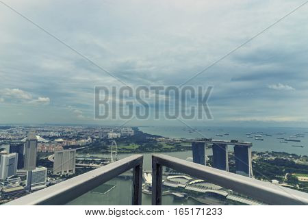 abstract conner of steel on rooftop and cityscape view singapore with vintage filter - can use to display or montage on product