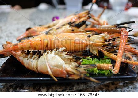 Burn shrim seafood on table. . .