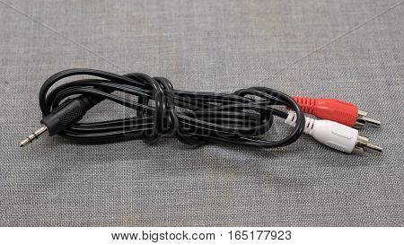audio cable RCA to 3.5mm jack on a gray background