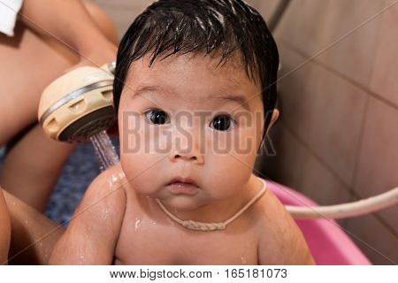 Cute asian baby newborn take a bath