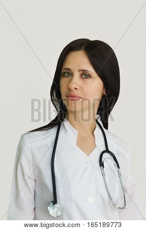 Portrait of young female doctor with a stethoscope.