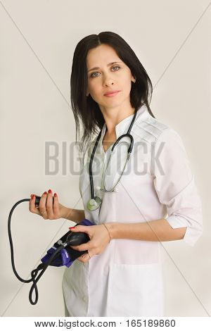 Young female doctor with a stethoscope. Close-up