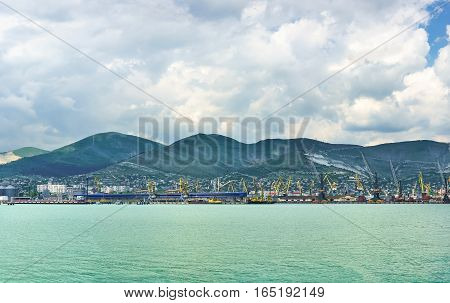Panorama of Novorossiysk sea port on the background ridge mountains