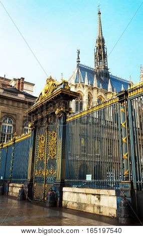 The Justice palace antry and Saint Chapelle in the background Paris France.