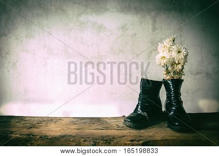 Still life old child deteriorate use for long time and dry wizened chrysanthemums.