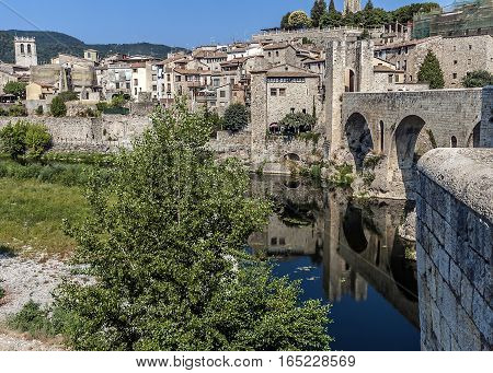 Spain Catalonia Girona Besalu. The first mention of the castle Besalu around which the town was formed refer to the tenth century . Castle towers over the hill where lie since the early Middle Ages the remains of Saint Mary .