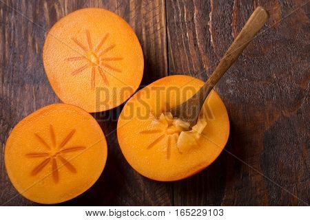 Diospyros Kaki On Rustic Wooden Background