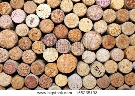 Background of used wine corks. Wall of many different wine corks. Closeup of wine corks.