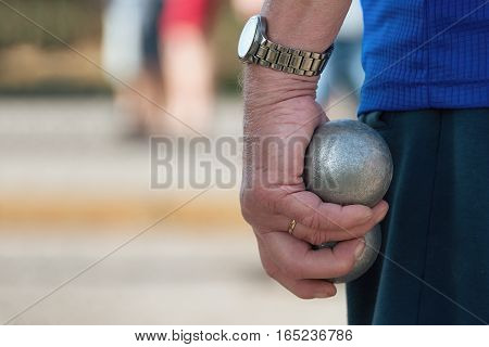 Senior playing petanque fun and relaxing game