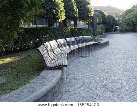 beautiful wooden bench in a arenzano garden in genova