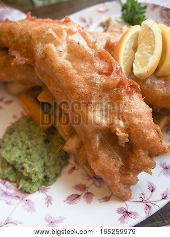 Fish 'n' chips is a very popular meal in Britain made of fried cod and potatoes.
