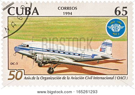 MOSCOW RUSSIA - January 15 2017: A stamp printed in Cuba shows aircraft DC-3 and emblem of ICAO series 