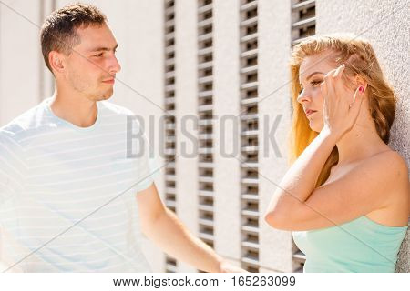 Man Flirting With Girl On City Street