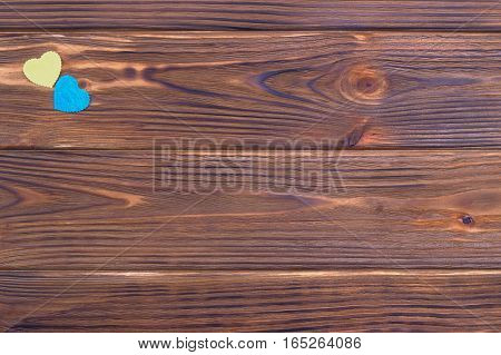 Blue And Yellow Hearts On Wooden Background