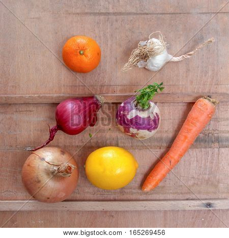 various vegetbles and citruses. radishonion carot lemonorangeaniongarlic
