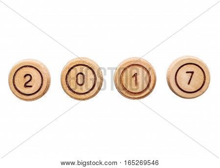 2017 text from small wooden barells. Isolated on white.