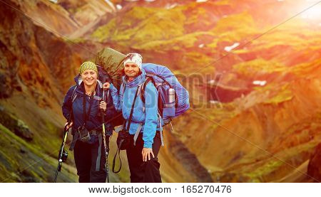 hikers on the trail in the Islandic mountains. Trek in National Park Landmannalaugar, Iceland
