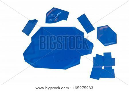 Collection of used blue electrical tape pieces