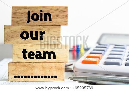 Text message Join our team on wooden with office table. Business concept