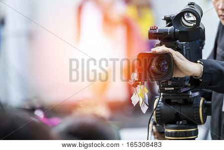 Video camera operator working with his equipment